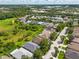 Aerial view showing the homes located within a vibrant residential community near plentiful green spaces at 27652 Sky Lake Cir, Wesley Chapel, FL 33544