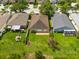 Home's backyard, featuring a well-manicured lawn, set within a tranquil neighborhood at 27652 Sky Lake Cir, Wesley Chapel, FL 33544