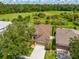 Aerial view of home showcasing green space and lush surrounding landscape at 27652 Sky Lake Cir, Wesley Chapel, FL 33544