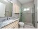 Bathroom with a glass shower, marble sink, and modern fixtures at 27652 Sky Lake Cir, Wesley Chapel, FL 33544