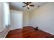 Bedroom with hardwood floors, window, and closet at 27652 Sky Lake Cir, Wesley Chapel, FL 33544