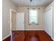 Bedroom with hardwood floors, window, and closet at 27652 Sky Lake Cir, Wesley Chapel, FL 33544
