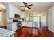 Modern kitchen with stainless steel appliances, granite countertops, and hardwood floors at 27652 Sky Lake Cir, Wesley Chapel, FL 33544