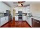 Stylish kitchen with stainless steel appliances, granite countertops and white cabinets at 27652 Sky Lake Cir, Wesley Chapel, FL 33544