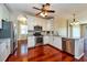 Modern kitchen with stainless steel appliances, granite countertops, and white cabinets at 27652 Sky Lake Cir, Wesley Chapel, FL 33544