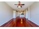 Bright living room featuring hardwood floors and views of the kitchen at 27652 Sky Lake Cir, Wesley Chapel, FL 33544