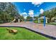 Community playground with swings, slides, and a shaded seating area, set in a well-maintained grassy area at 27652 Sky Lake Cir, Wesley Chapel, FL 33544