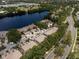 This aerial view highlights the community's proximity to a lake, a baseball field and scenic roadways at 2804 Countryside Blvd # 4, Clearwater, FL 33761