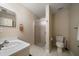 Neutral bathroom showcases a glass-enclosed shower, white fixtures, and minimalist decor for a clean look at 2804 Countryside Blvd # 4, Clearwater, FL 33761