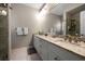 Primary bathroom features a granite countertop, double sinks, and a walk-in shower at 2804 Countryside Blvd # 4, Clearwater, FL 33761