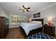Comfortable bedroom with wood floors, plantation shutters, and serene natural light at 2804 Countryside Blvd # 4, Clearwater, FL 33761