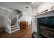Elegant foyer with staircase, wood flooring, and a glimpse into the living spaces, creating a warm welcome at 2804 Countryside Blvd # 4, Clearwater, FL 33761