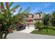 Charming townhouse with a two-car garage and inviting curb appeal, enhanced by flowering trees and lush landscaping at 2804 Countryside Blvd # 4, Clearwater, FL 33761