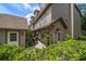 Well-maintained exterior featuring a private entrance with decorative landscaping and a charming walkway at 2804 Countryside Blvd # 4, Clearwater, FL 33761