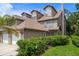 Exterior view showcasing the architecture and well-maintained landscaping of the residential property at 2804 Countryside Blvd # 4, Clearwater, FL 33761