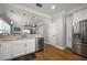 Bright kitchen features stainless steel appliances, white cabinets, and an open design at 2804 Countryside Blvd # 4, Clearwater, FL 33761