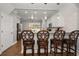 Modern kitchenette features white cabinetry, stainless steel appliances, and bar seating, perfect for casual dining at 2804 Countryside Blvd # 4, Clearwater, FL 33761