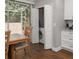 Cozy breakfast nook with views of enclosed patio, featuring convenient laundry closet at 2804 Countryside Blvd # 4, Clearwater, FL 33761