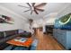 Open-concept living room with wood floors, a fireplace, and stairs to the upper level, offering a comfortable and stylish space at 2804 Countryside Blvd # 4, Clearwater, FL 33761