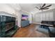 Bright and airy living room with a fireplace, hardwood floors, and plantation shutters, ideal for relaxation and entertainment at 2804 Countryside Blvd # 4, Clearwater, FL 33761