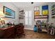 Functional home office with wood floors, desk, shelving, and ample storage space at 2804 Countryside Blvd # 4, Clearwater, FL 33761