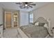 Comfortable bedroom featuring a plush bed, ceiling fan, and an ensuite bathroom at 2866 Quail Crest Ct, Valrico, FL 33594
