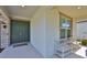 Welcoming front porch with double doors, a cozy seating area, and stone accents at 2866 Quail Crest Ct, Valrico, FL 33594