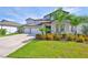 Charming two-story home with a three-car garage, landscaped front yard, and a cozy porch at 2866 Quail Crest Ct, Valrico, FL 33594