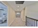 Well-lit upstairs hallway featuring carpeting, overhead lights and stairway at 2866 Quail Crest Ct, Valrico, FL 33594