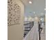 Spacious second story hallway with decorative wall hangings and neutral paint at 2866 Quail Crest Ct, Valrico, FL 33594