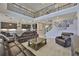 Spacious living room with high ceilings, open floor plan, staircase, and view of the kitchen at 2866 Quail Crest Ct, Valrico, FL 33594