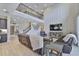Bright living room with high ceilings, balcony, wood-look flooring, and leather furniture at 2866 Quail Crest Ct, Valrico, FL 33594