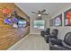 Sports-themed room featuring a wood wall, sports memorabilia, and comfortable seating at 2866 Quail Crest Ct, Valrico, FL 33594