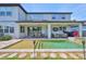 Beautiful pool area with a covered patio including an outdoor kitchen, dining and living area at 2866 Quail Crest Ct, Valrico, FL 33594
