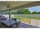 Covered patio overlooking a swimming pool with a water feature and fenced yard at 2866 Quail Crest Ct, Valrico, FL 33594