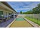 Gorgeous pool and patio in this large backyard with a white fence, and outdoor lighting at 2866 Quail Crest Ct, Valrico, FL 33594