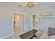 Sitting area features neutral walls, art and an ornate light fixture above a dark wood table at 2866 Quail Crest Ct, Valrico, FL 33594