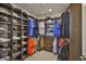 Large walk-in closet with built-in shelving and hanging racks that provide plenty of storage at 2866 Quail Crest Ct, Valrico, FL 33594