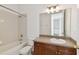 Functional bathroom featuring a bathtub with shower, vanity, and a large mirror at 3111 W De Leon St # 9, Tampa, FL 33609