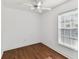 Cozy bedroom featuring laminate flooring, white walls, and a ceiling fan at 3111 W De Leon St # 9, Tampa, FL 33609