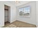 Cozy bedroom with carpet, closet space, and a window providing a scenic view at 3111 W De Leon St # 9, Tampa, FL 33609