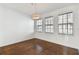 Inviting dining room with hardwood floors, modern chandelier, and large windows at 3111 W De Leon St # 9, Tampa, FL 33609