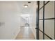 Inviting hallway with tile flooring, white walls, and a staircase leading to the upper level at 3111 W De Leon St # 9, Tampa, FL 33609
