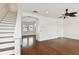 Bright living room featuring hardwood floors, staircase, and natural light at 3111 W De Leon St # 9, Tampa, FL 33609