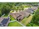 Aerial view of a home with a fenced backyard and mature trees at 320 Roxbury Crossing Ct, Valrico, FL 33594