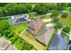 Birds eye view of homes showcasing solar panels, a pool, and fenced yards at 320 Roxbury Crossing Ct, Valrico, FL 33594