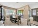 Formal dining room with a large table, seating for ten, and sliding doors leading to the outdoor space at 320 Roxbury Crossing Ct, Valrico, FL 33594
