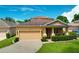 Lovely single-Gathering home with a manicured front yard, two car garage, and covered entrance at 320 Roxbury Crossing Ct, Valrico, FL 33594