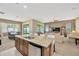 Open concept kitchen with a large island perfect for entertaining guests at 320 Roxbury Crossing Ct, Valrico, FL 33594