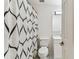 Clean bathroom with a black and white shower curtain and updated vanity at 3335 Fox Hunt Dr, Palm Harbor, FL 34683
